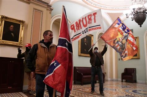 Jan. 6 participant who carried Confederate flag into Capitol begins ...