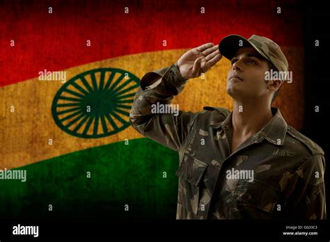 Soldier saluting with Indian flag in background Stock Photo - Alamy