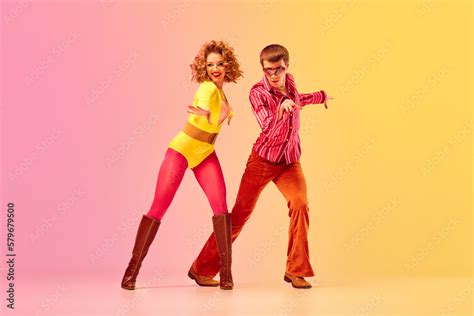 Disco style. Young emotional man and woman, professional dancers in ...