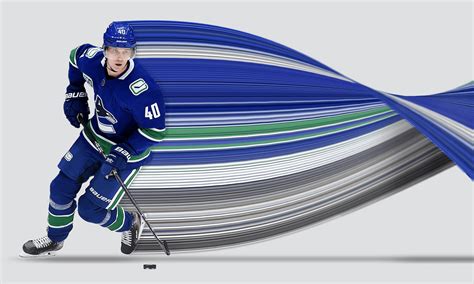 Download NHL Player Elias Pettersson In Action Wallpaper | Wallpapers.com