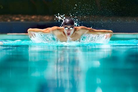 Perfect Butterfly Stroke. a Male Swimmer Doing the Butterfly Stroke Toward the Camera. Stock ...