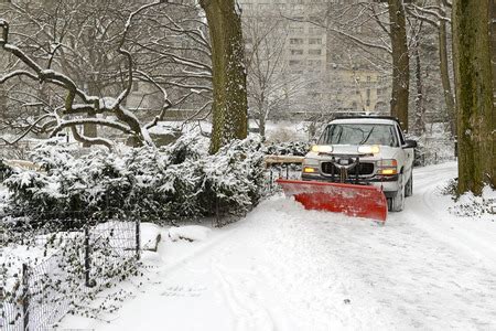 Driveway Snow Plowing: Four Benefits of Hiring Professionals