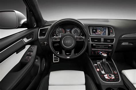 the interior of an audi car with white and black leather seats ...