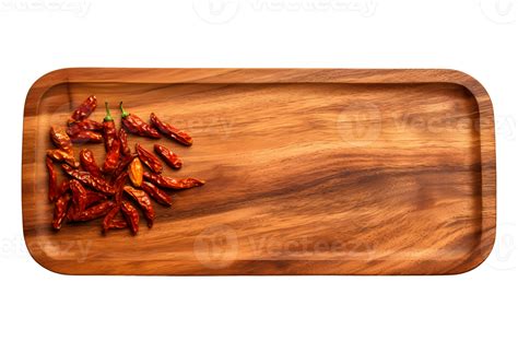 Dried chilies on a wooden cutting board, with empty space, flat lay top ...