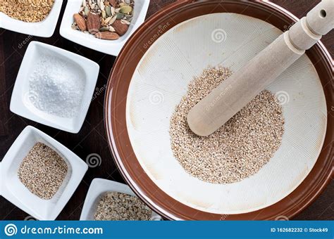 Preparation of Gomashio Gomasio - Sekihan Seasoning with Sesame Seeds and Salt in Suribachi ...