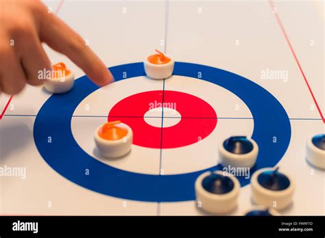 Table curling game Stock Photo - Alamy