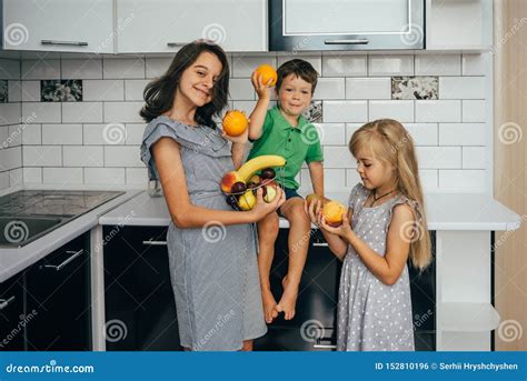 Happy Family Eating Fresh Fruit. the Concept of Healthy Eating Stock ...