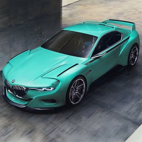 a green bmw concept car driving down the road