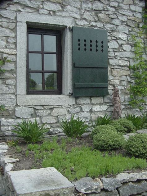 Stone Wall Board and Batten Shutters