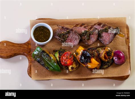 Grilled beef and vegetables with sauce Stock Photo - Alamy