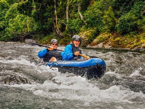 Couple kayaking rapids at the Pelorus river | Kayak New Zealand