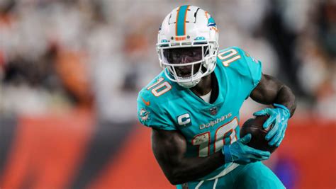 Miami Dolphins star Tyreek Hill in walking boot after suffering foot injury