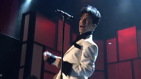 Prince performs "Kiss" at the 2004 Rock & Roll Hall of Fame Induction ...