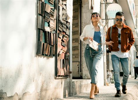 Photo of Man and Woman Walking on Sidewalk · Free Stock Photo