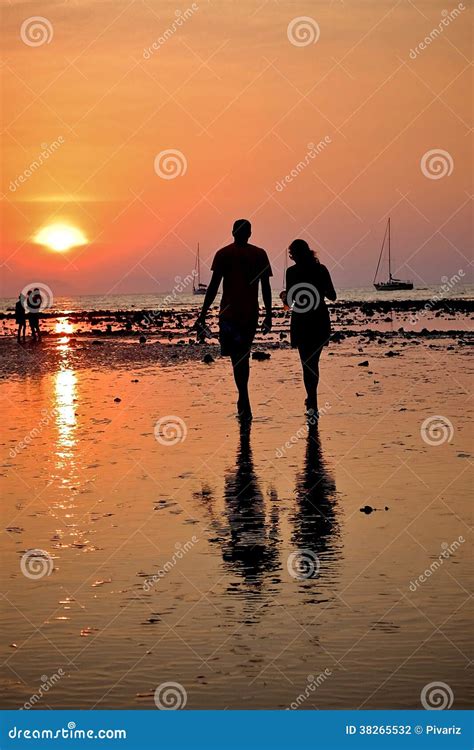 Two People Walking during Sunset Stock Photo - Image of date, boat: 38265532