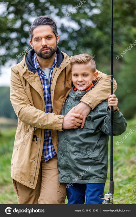 Father hugging his son — Stock Photo © SashaKhalabuzar #169519392