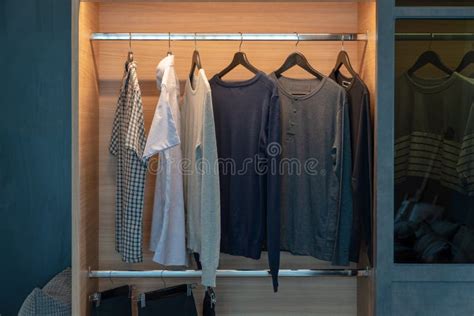 Modern Closet with Clothes Hanging Stock Photo - Image of dress, rack ...