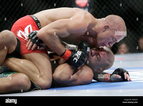 Georges St-Pierre, top, fight Thiago Alves during UFC 100 at the ...