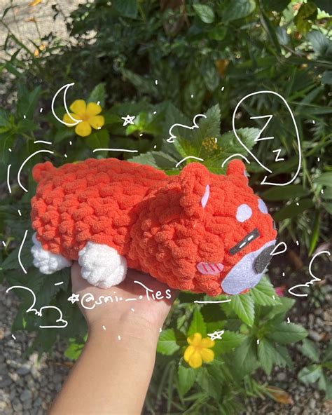 A cute sleeping crochet plushie that is a orange shiba inu Shiba Inu, Plushies, Crochet Hats ...