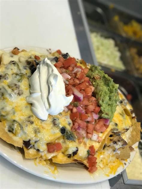 It’s National Nachos Day!... - Howling Wolf Taqueria Express