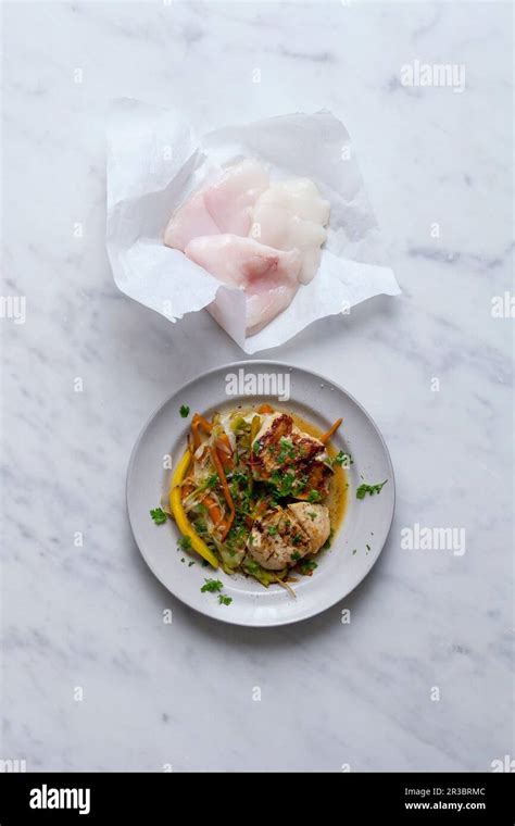 Pan fried monkfish cheeks Stock Photo - Alamy