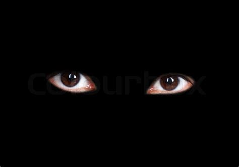 Eyes of a girl isolated on black background | Stock Photo | Colourbox