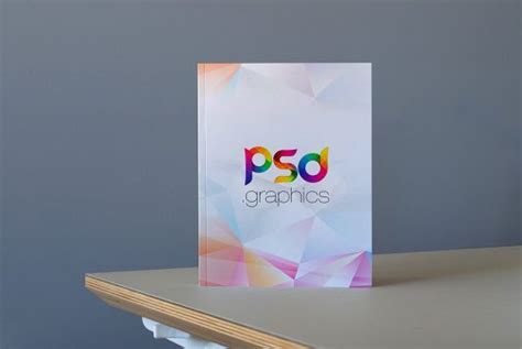 Hardcover Book on Table Mockup | PSD Graphics