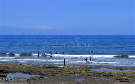 Surfing on Playa De Las Americas Beach Stock Image - Image of boards, people: 75022929