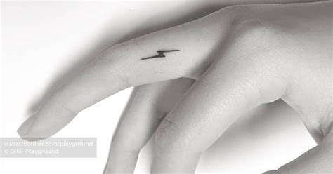 Minimalistic lightning bolt tattoo done on the finger.