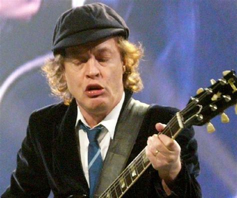 Angus Young Biography - Facts, Childhood, Family Life & Achievements