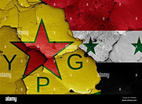 flags of YPG and Syria painted on cracked wall Stock Photo - Alamy