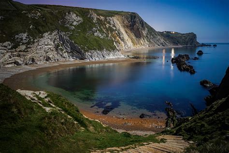 Man o war bay in England seen on a clear beautiful night. Photograph by George Afostovremea ...