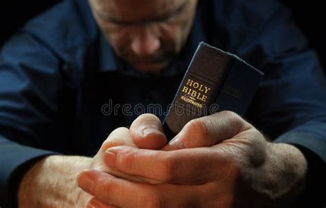 A Man Praying Holding A Bible. Stock Image - Image of adult, faith ...