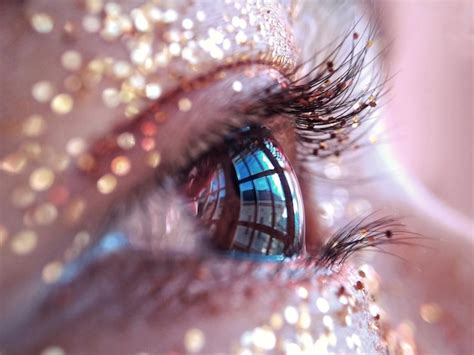 Premium Photo | Extreme close-up of woman eye with glitter