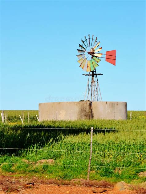 Windmill water pump stock image. Image of meadow, pump - 26748229