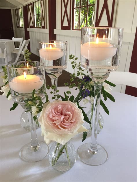 Simple floating candle and bud vase cluster with roses, tweedia, ve… | Candle wedding ...