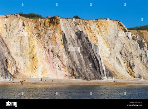 Famous multi coloured layered sands of the sandy cliffs of Alum Bay ...