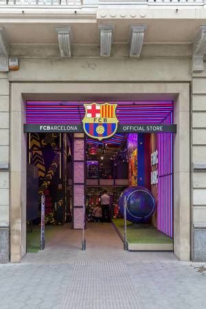 Street vendor sells Lionel Messi FC Barcelona soccer jerseys and Kylian Mbappé Merchandise at a ...