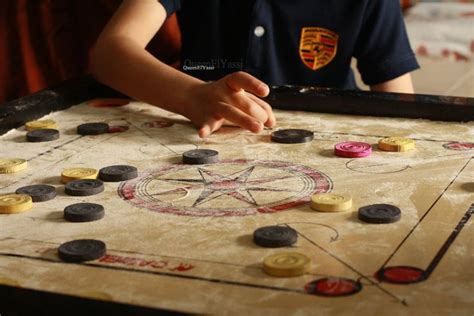 Was playing with my camera and saw the kids playing carrom so i decided ...