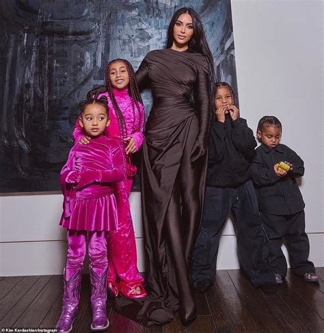 Kim Kardashian shares new photos as she poses in brown with her four ...