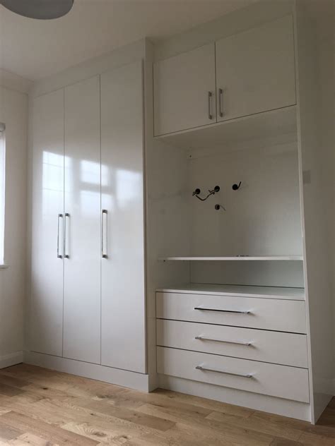 the perfect solution for fitted wardrobes in a small room in London. Plenty of hanging space a ...