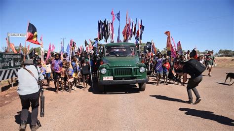 Thousands recreate the Wave Hill walk-off, originally led by Vincent Lingiari, at the Freedom ...