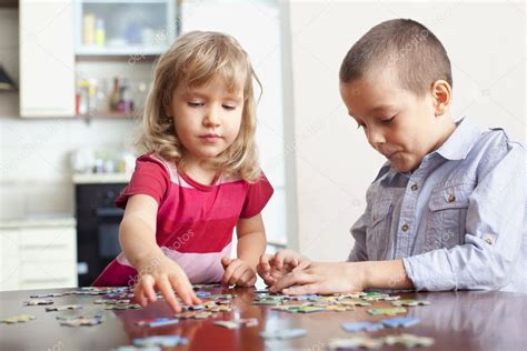 Children, playing puzzles — Stock Photo © TatyanaGl #5048899