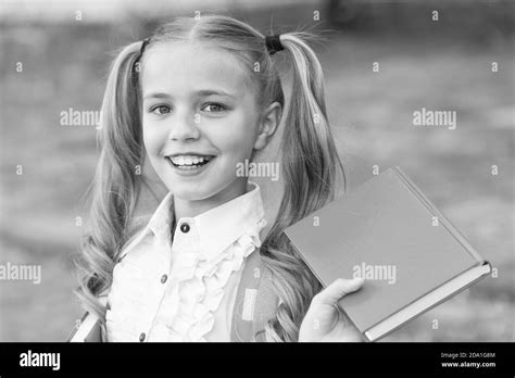 Schoolgirl reading text Black and White Stock Photos & Images - Alamy