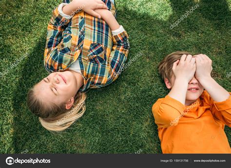 Kids lying on grass — Stock Photo © alebloshka #159131756