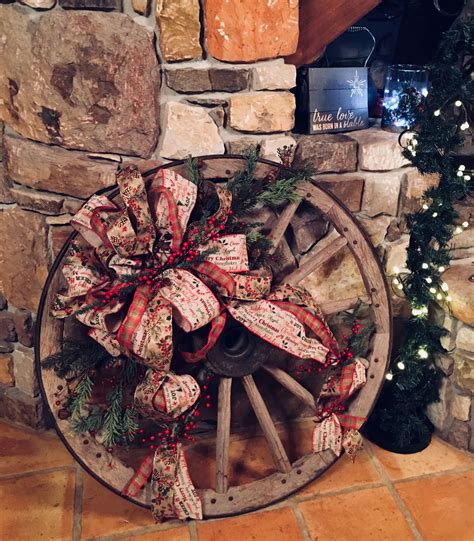 Christmas decorated wagon wheel | Christmas decorations rustic, Summer ...