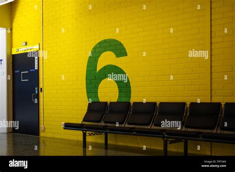 Green number 6 painted on yellow brick wall in Oulu University campus Stock Photo - Alamy