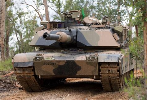 An Australian Army M1A1 Abrams tank from 1st Armoured Regiment moves into position during ...