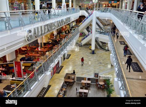 Inside The Galleries shopping centre Bristol Shopping Quarter with view of floors and food hall ...