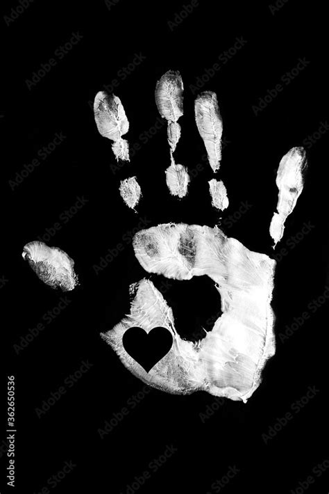 White handprint with heart on a black background.Together. Palm print ...